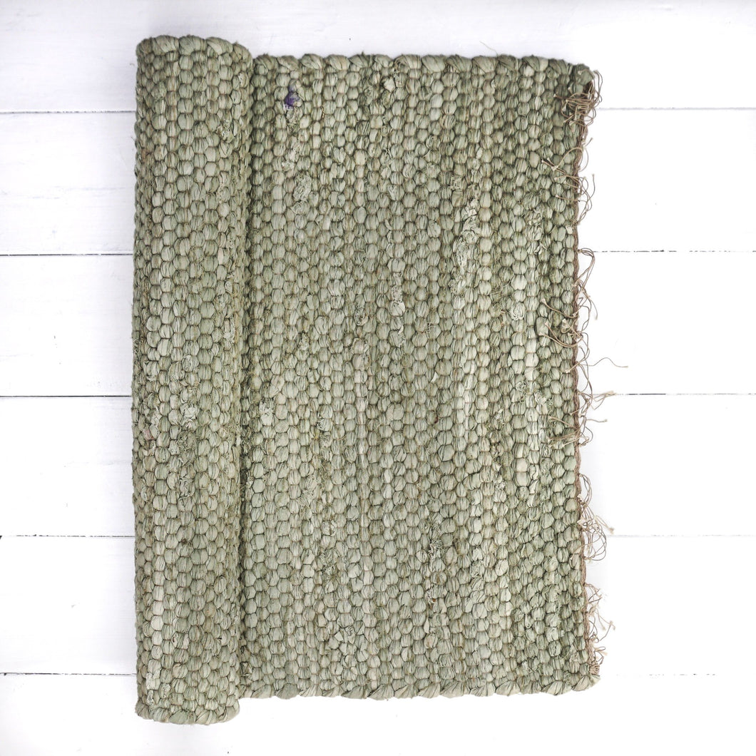 sage green cotton jute rug with fringe