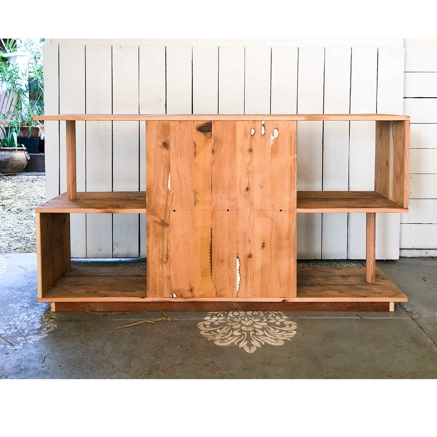 The Ess Shelf-clean modern 3 shelf "s" style open shelf, warm stained wood