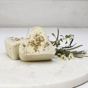 Cream colored heart shaped soap with essential oils and french clay