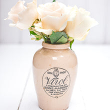 Load image into Gallery viewer, cream colored ceramic vase with black logo