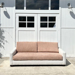 boucle fabric sofa, two toned with cream body and dusty rose cushions